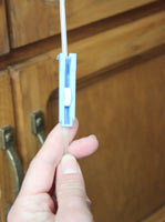 Use the roller clamp to open or close the fluid line. The roller clamp controls whether fluids are allowed to flow.