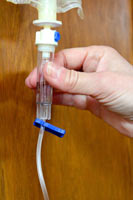 The reservoir at the top of the fluid line should be half-full of fluid. Push and release the reservoir to fill it hallway with fluid.